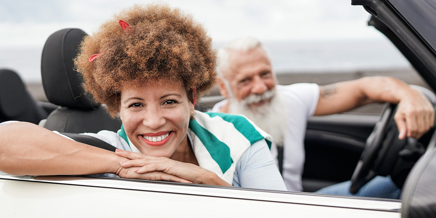 BetterDry Day adult briefs offer medium protection. Long car drives aren't an issue anymore! Here a couple is smiling while preparing for a car trip.